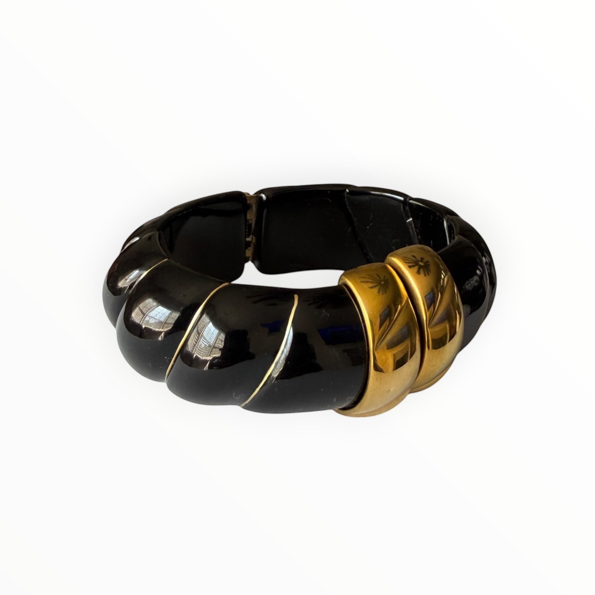 TALI The Riviera resin bracelet in black with gold-plated accents and a chunky, ribbed design.