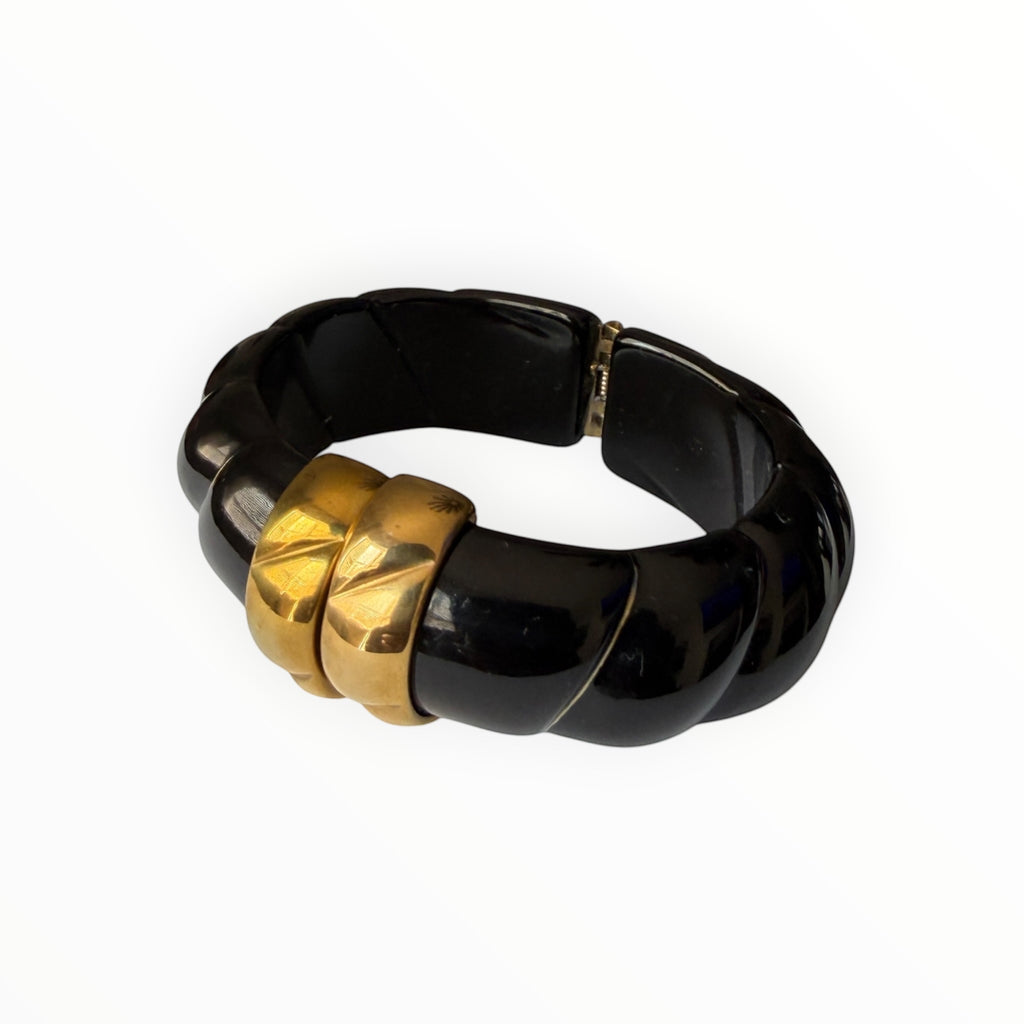 TALI The Riviera resin bracelet in black with gold-plated accents and a chunky, ribbed design.