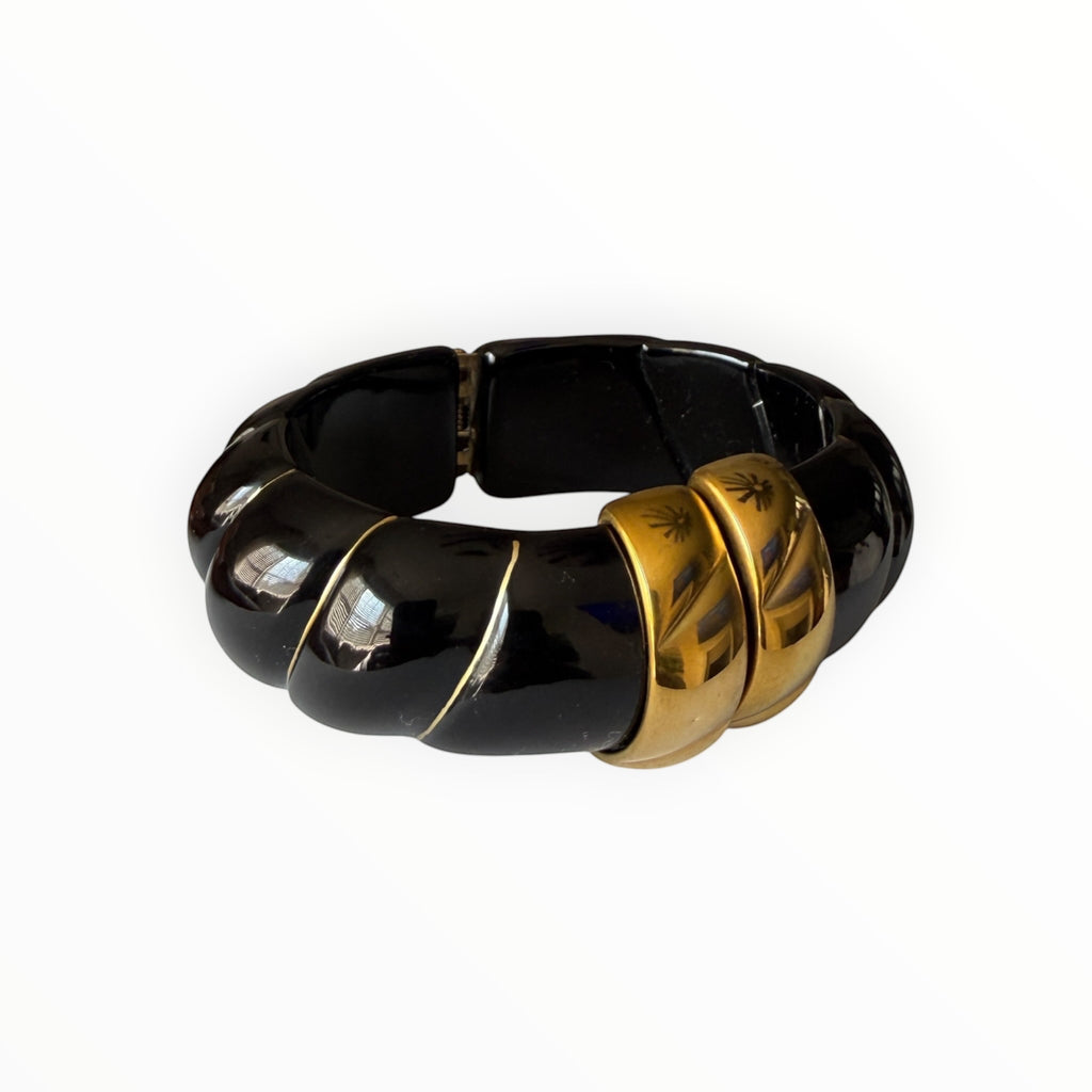 TALI The Riviera Resin Bracelet in glossy black resin with gold-plated accents and engraved palm tree details.