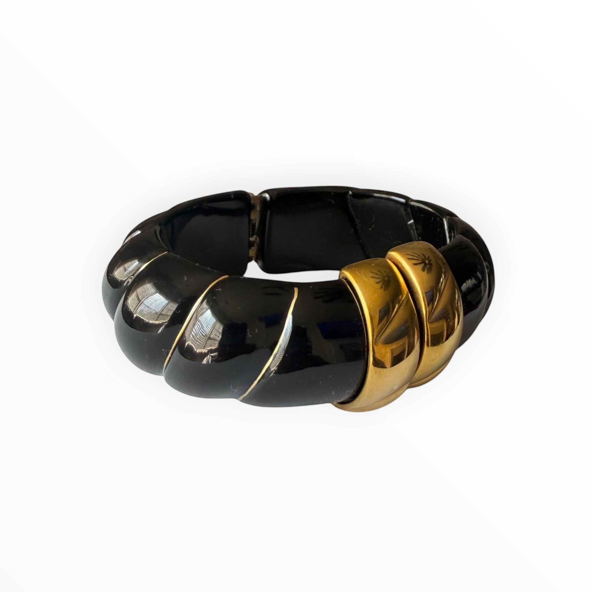 TALI The Riviera Resin Bracelet in black resin with gold-plated accents and a chunky, ribbed design.