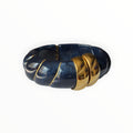 TALI The Riviera resin bracelet in navy blue with gold-plated ribbed accents for a statement look.