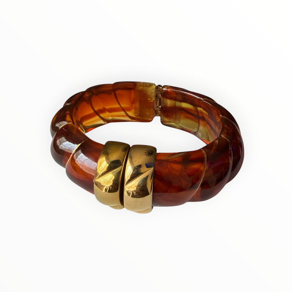 TALI The Riviera resin bracelet in amber tortoise shell with gold plated accents and a hinged design.
