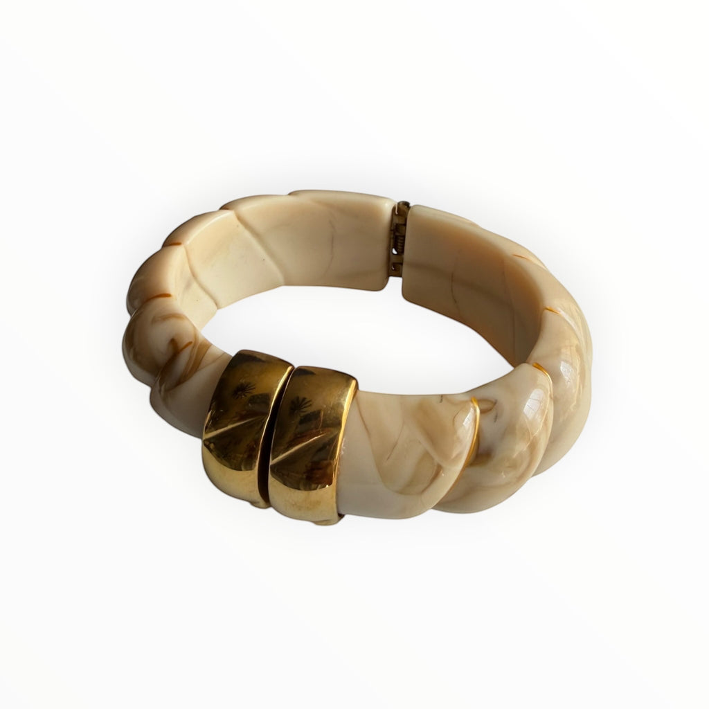 TALI The Riviera resin bracelet in cream and brown marble pattern with gold plated accents on a white background.