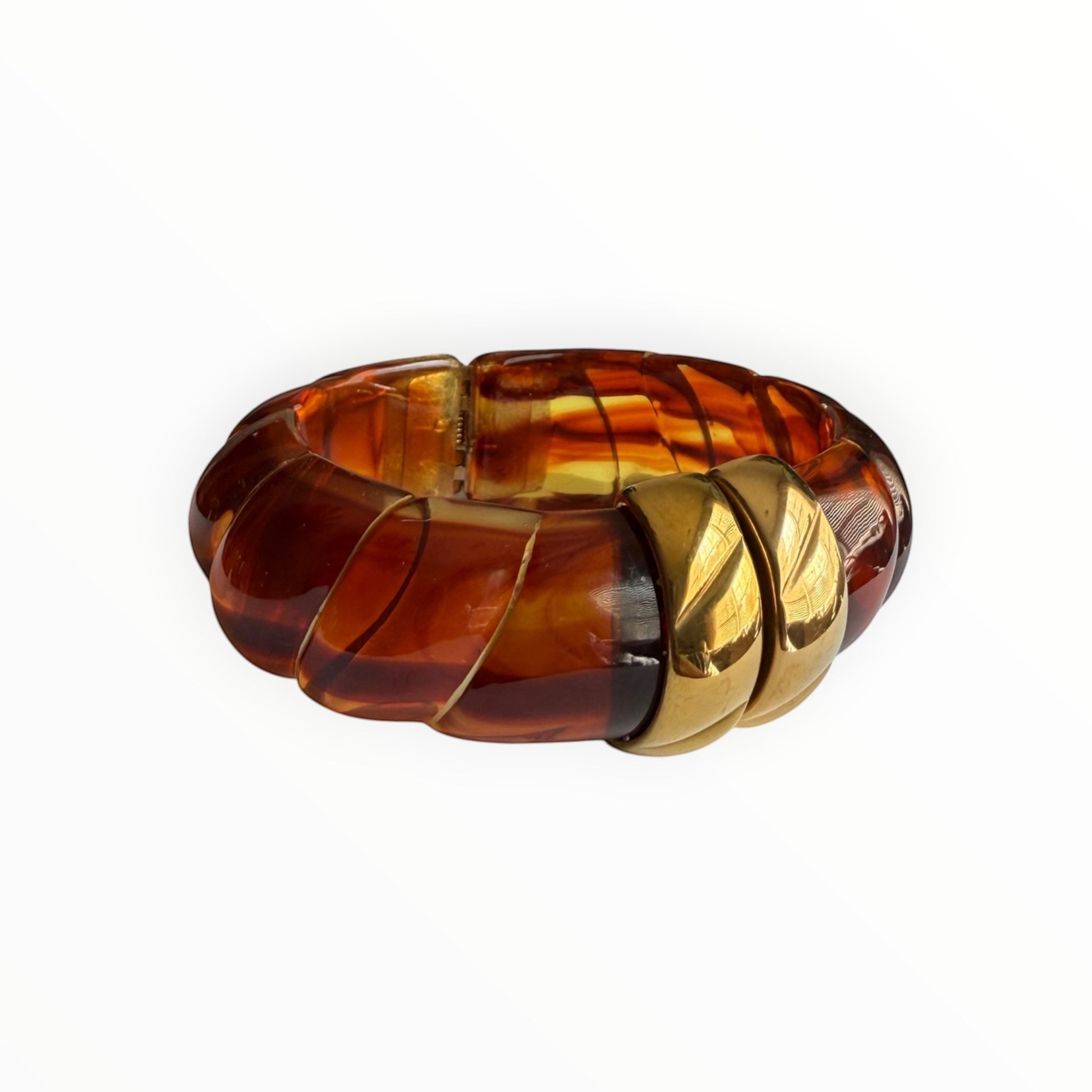 TALI The Riviera resin bracelet featuring amber-toned tortoiseshell segments accented with polished gold-plated links.