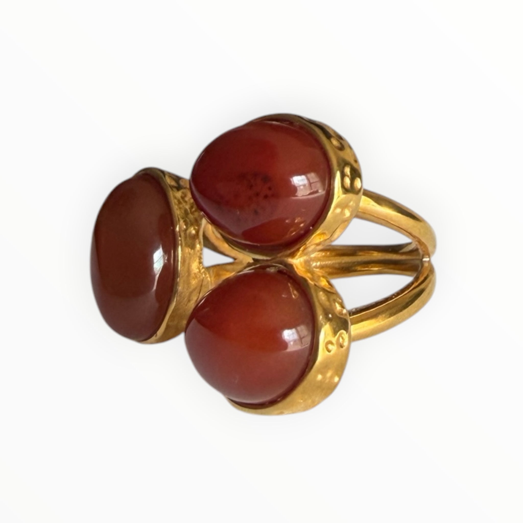 TALI triple oval cabochon stone statement ring in gold-toned metal with a hammered edge and split-shank band.