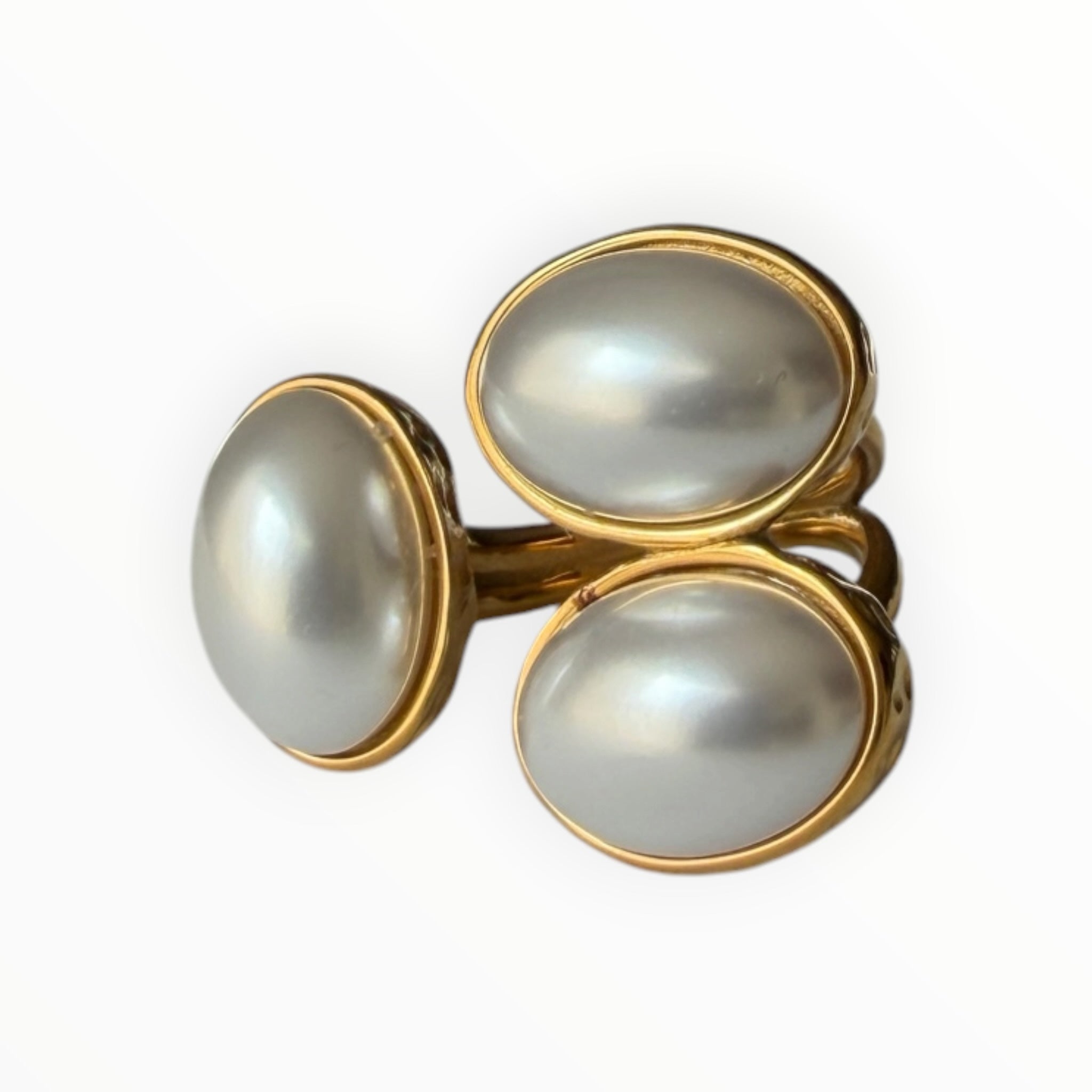 TALI triple oval stone statement ring featuring three smooth cabochon stones in a gold-toned hammered metal setting.