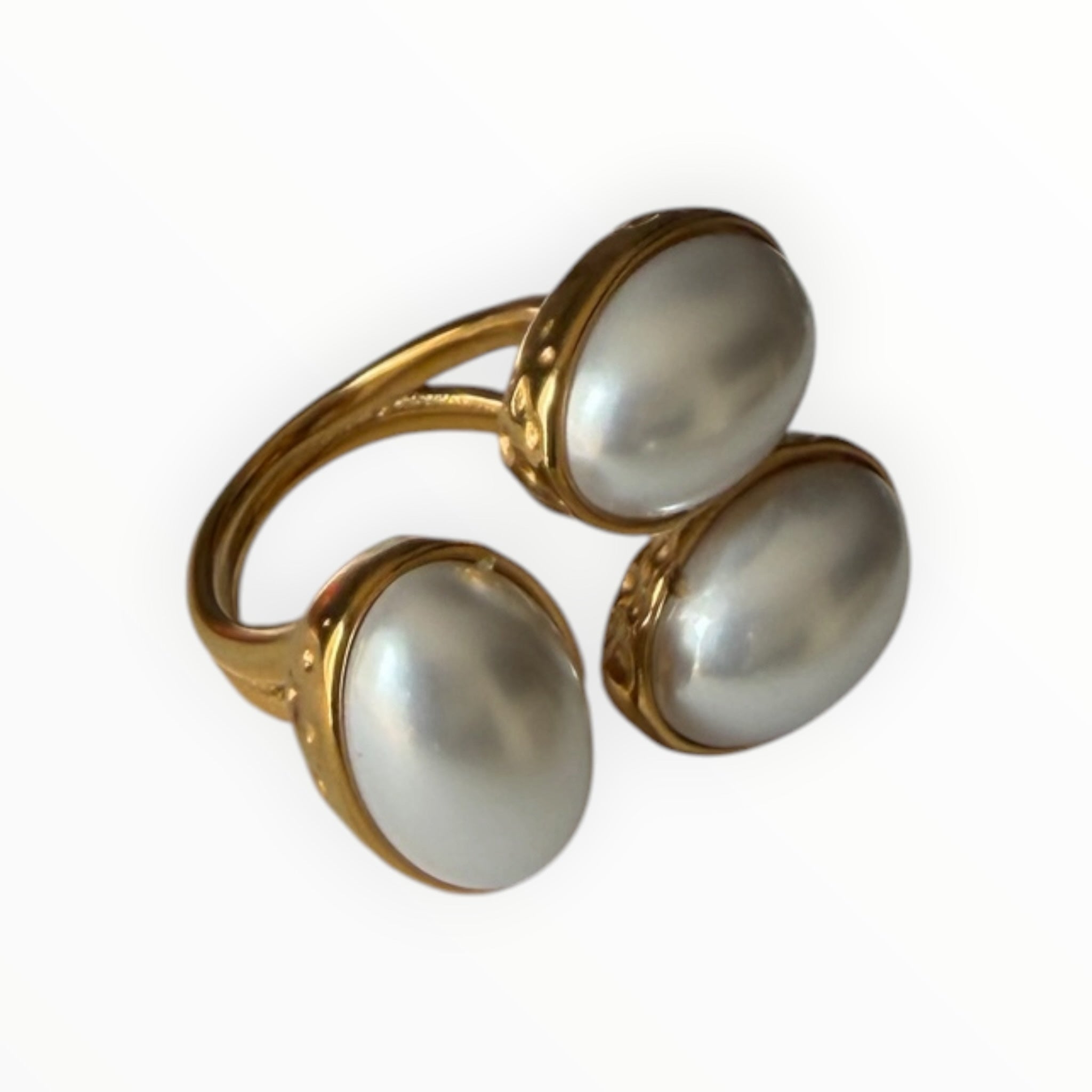 TALI statement ring featuring three oval cabochon stones in a gold-toned hammered metal setting with a split shank.