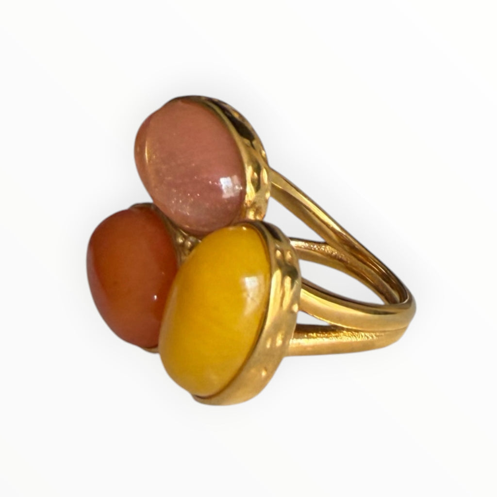 TALI triple oval stone statement ring featuring pink, orange, and yellow cabochons in a hammered gold-tone setting.