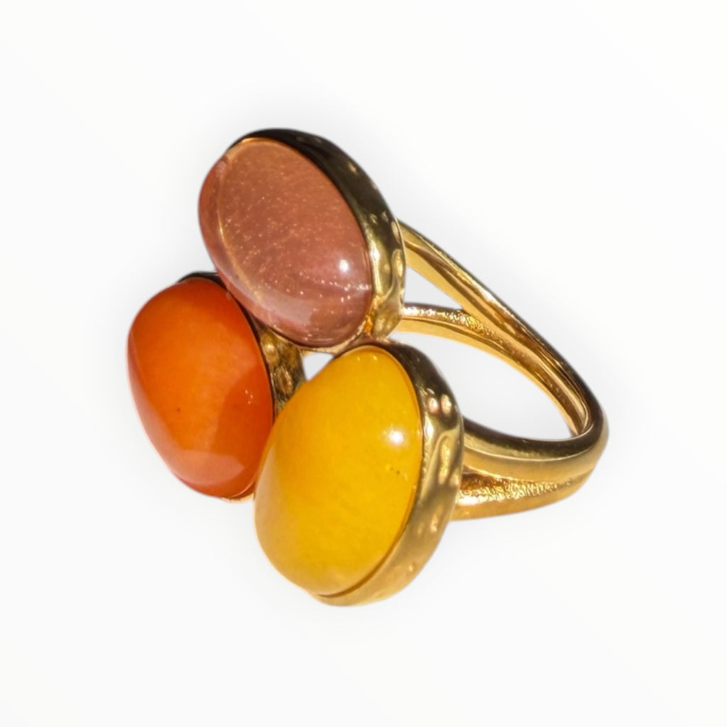TALI triple oval stone statement ring with orange, yellow, and peach cabochons in a hammered gold-tone metal setting.