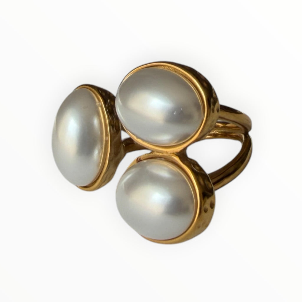 TALI triple oval stone statement ring featuring three smooth cabochon stones in a hammered gold-toned metal setting.