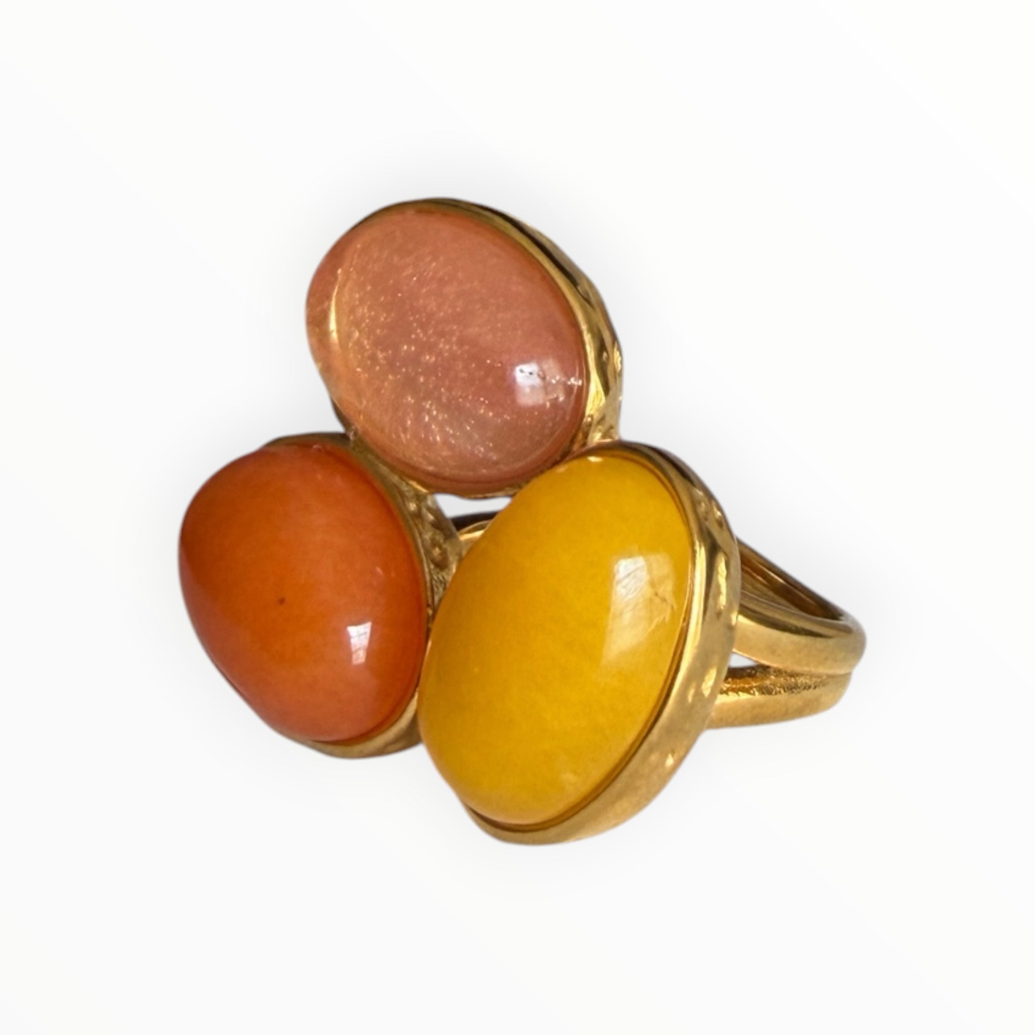 TALI statement ring featuring three oval cabochon stones in peach, orange, and yellow set in a hammered gold-tone frame.