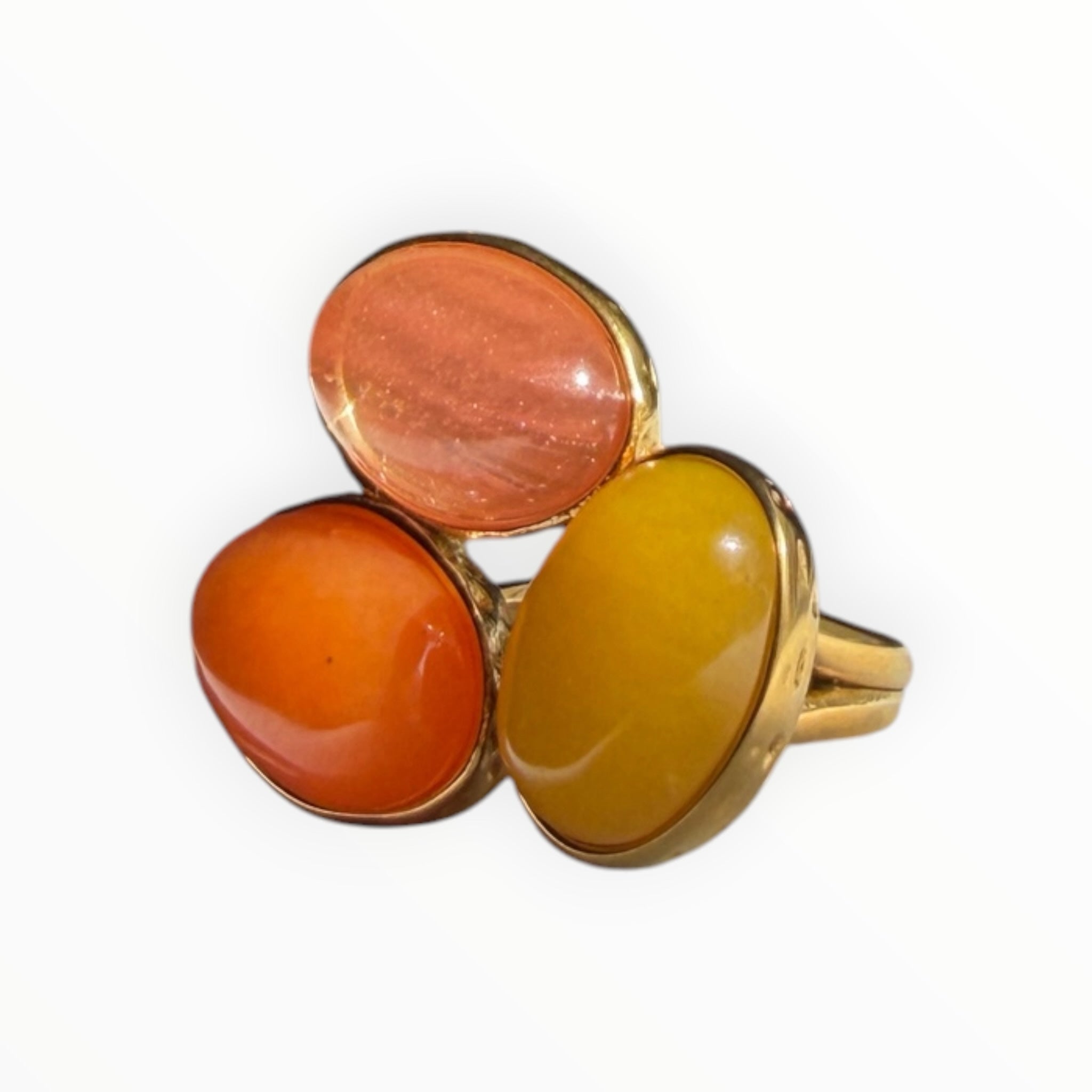 TALI triple oval stone statement ring featuring orange and yellow cabochon stones in a hammered gold-toned setting.