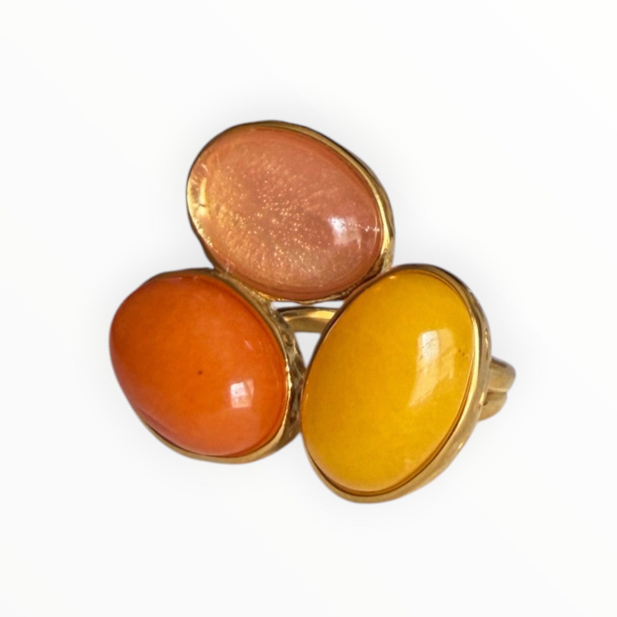 TALI statement ring featuring three oval cabochon stones in shades of peach, orange, and yellow set in gold-tone metal.